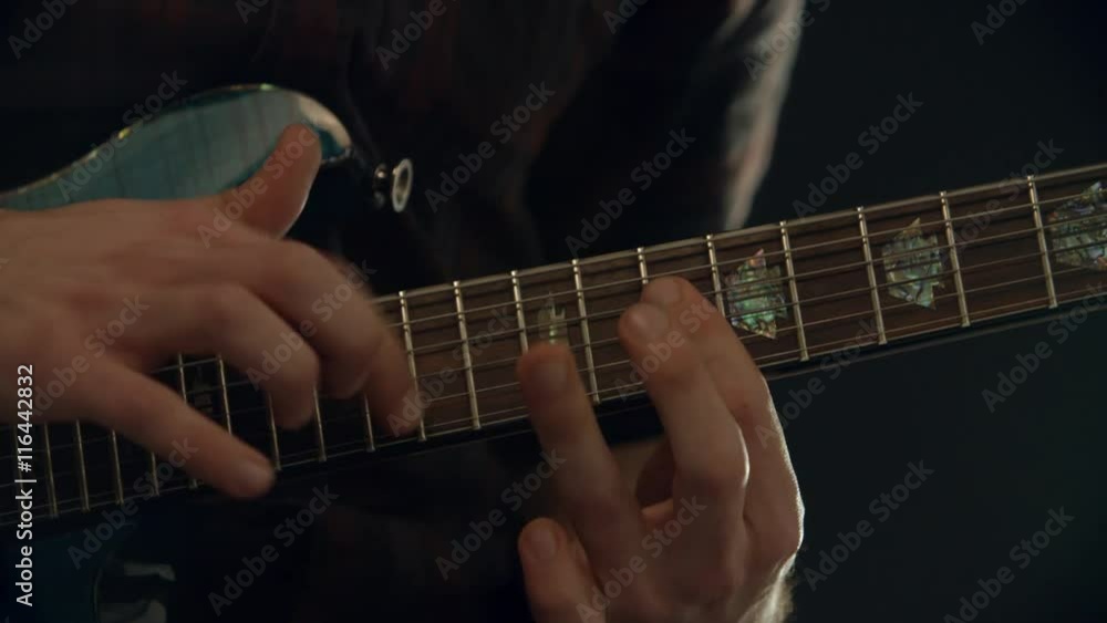 Slow Motion Shot Of Man Playing Electric Guitar Slow Motion Shot Of Man Playing Electric Guitar