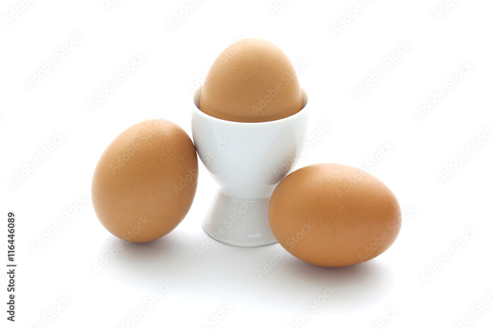 close up egg with egg cup isolated on white background close up egg with egg cup isolated on white background