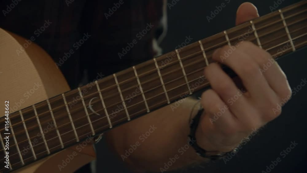 Slow Motion Shot Of Man Playing Acoustic Guitar Slow Motion Shot Of Man Playing Acoustic Guitar