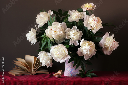 Still life with a bouquet of peonies and shell.