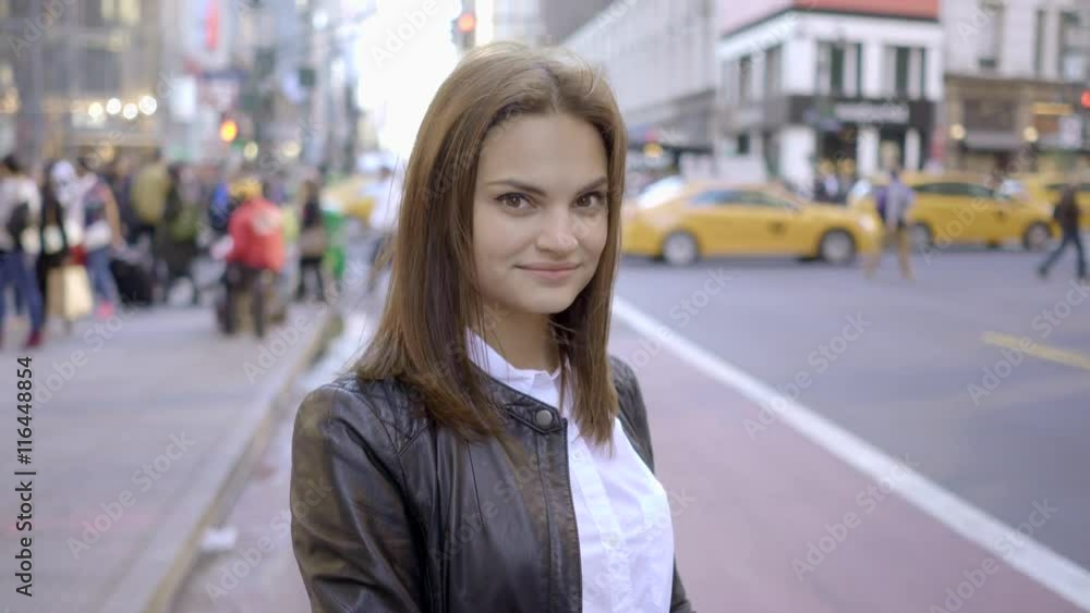 Young business women using smart phone while walking in the city at night Young business women using smart phone while walking in the city at night