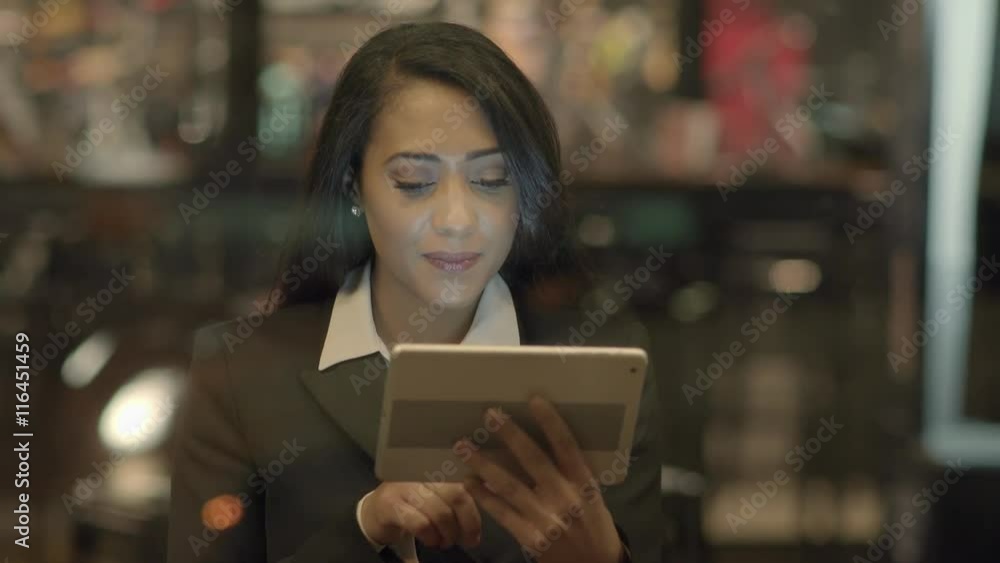portrait of african american women using tablet computer searching the internet