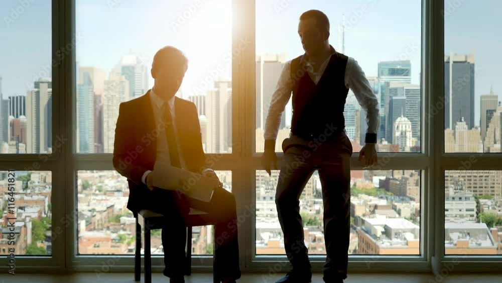 business people in high rise office building. city skyline window view business people in high rise office building. city skyline window view