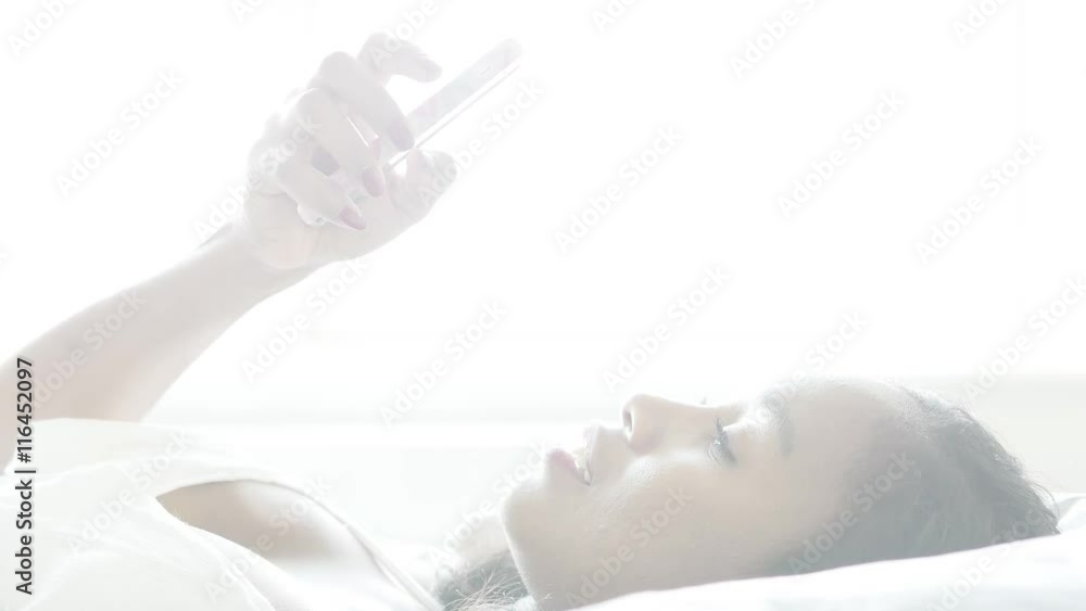 portrait of young black women relaxing at home. african female using smart phone portrait of young black women relaxing at home. african female using smart phone