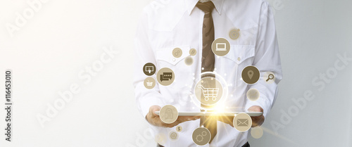 shopping cart with application software icons on tablet 