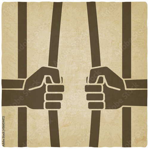 freedom concept. hands breaking prison bars old background