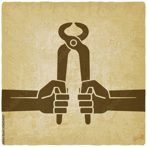 worker hands with pincers old background