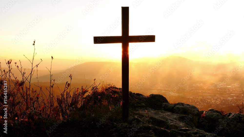cross standing on cliff in memory of suicidal person. peaceful death background cross standing on cliff in memory of suicidal person. peaceful death background