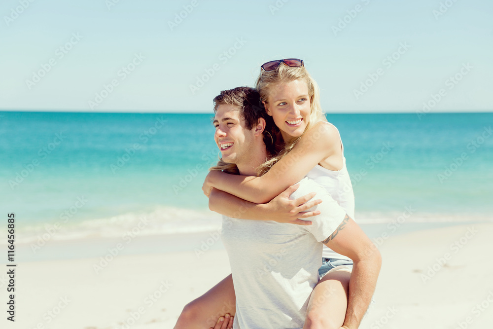 Portrait of man carrying girlfriend on his back Portrait of man carrying girlfriend on his back