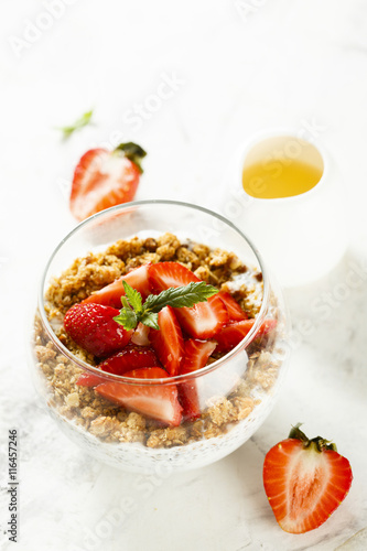 Homemade dessert with granola and berries