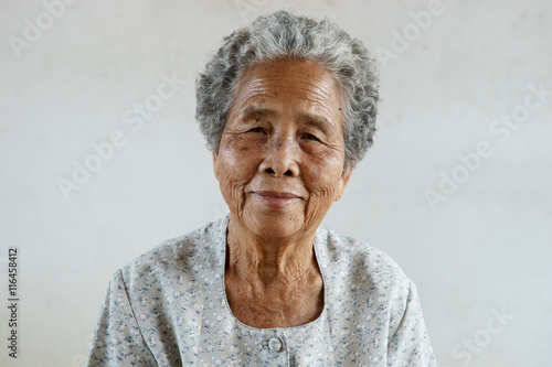 Smilling of happy Asian elderly senior on white background photo