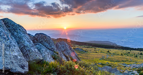 Black Peak (Cherni Vrah) on Vitosha mountain, Bulgaria - 2290 m. Last rays of sunlight through the rocks.