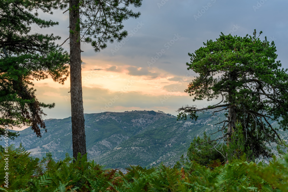 Sun is setting behind dramatic clouds over Thassos Island, Greece - spectacular landscape, shot from a high view point 