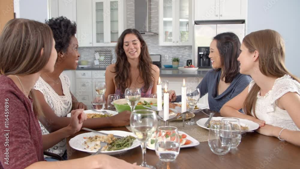 Female friends make a toast and eat at a table, slow motion Female friends make a toast and eat at a table, slow motion