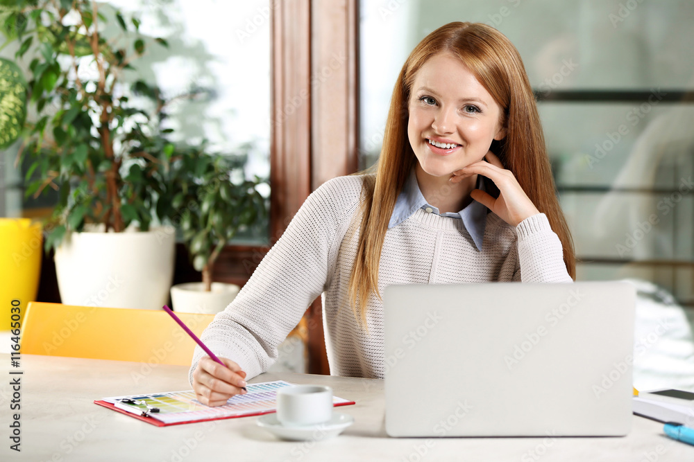 Creative girl working with laptop in office Creative girl working with laptop in office