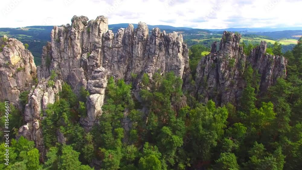 Camera flight over mountain range. Video from drone. National park Cesky Raj near Prague in Czech Republic. Amazing places in Central Europe. Destination for hiking, mountaineering and climbing. Camera flight over mountain range. Video from drone. National park Cesky Raj near Prague in Czech Republic. Amazing places in Central Europe. Destination for hiking, mountaineering and climbing.