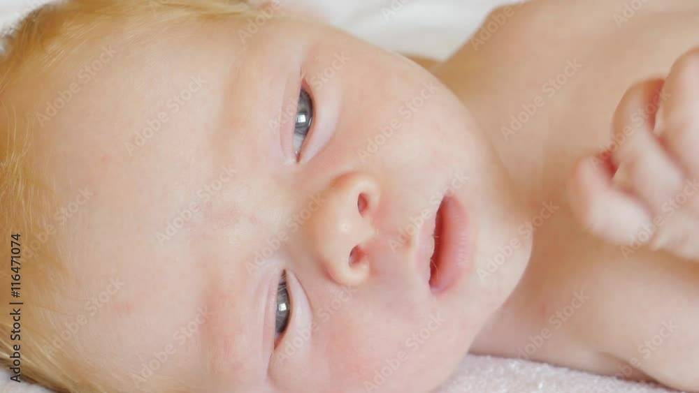 A newborn baby looks and emotes , 5 day
A newborn baby looks and emotes , 5 day