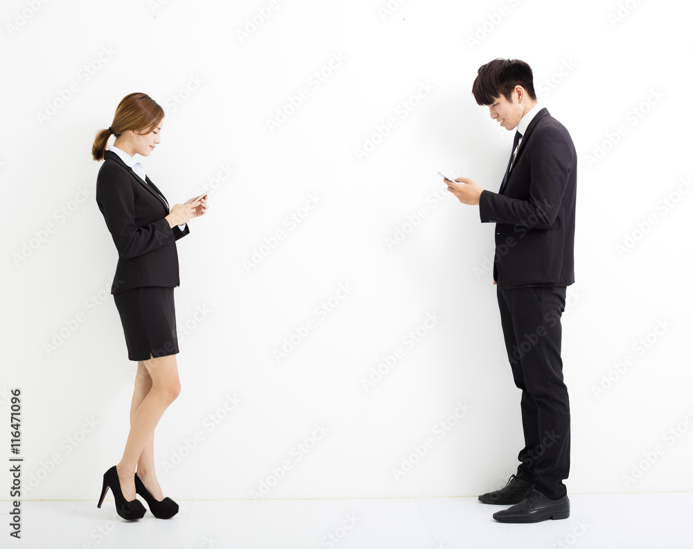 young business man and woman holding smart phone young business man and woman holding smart phone
