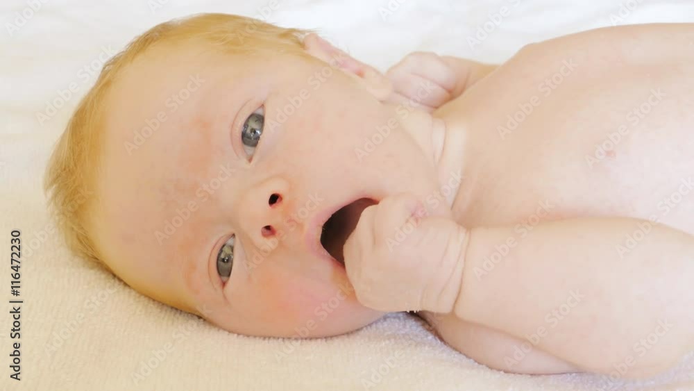 A newborn baby looks and emotes , 5 day A newborn baby looks and emotes , 5 day