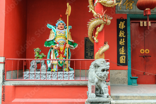 Photography lion and warrior in the entry of a Chinese temple in kuala lumpur, Malaysia