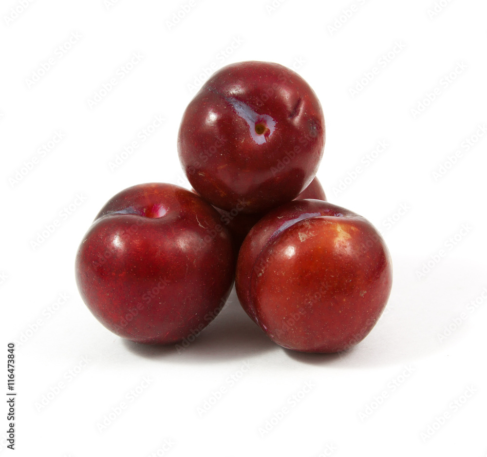 ripe purple cherry plums isolated
