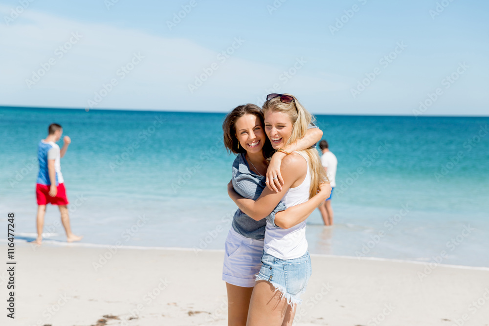 Woman friends on the beach
