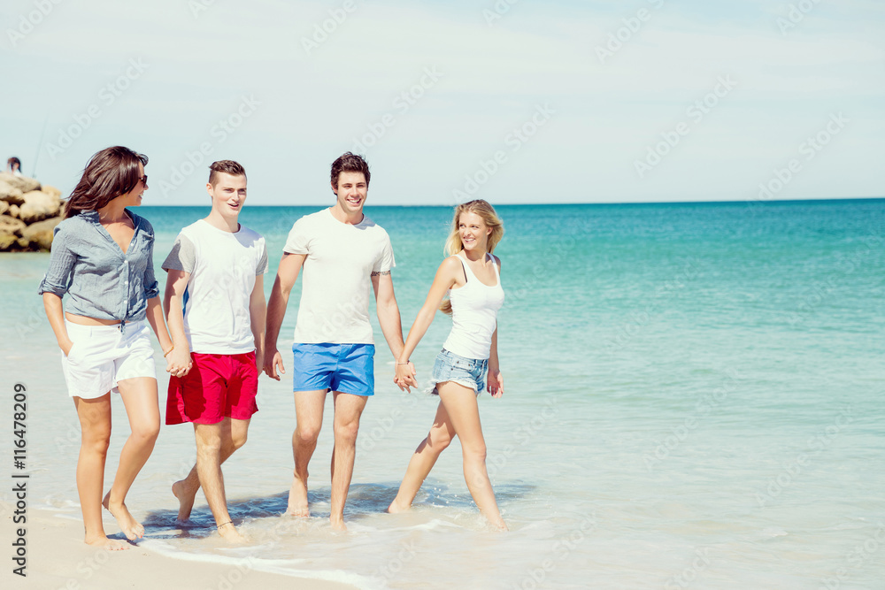 Company of young people on the beach