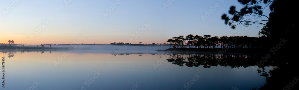 Panorama view of reservoir on sunrise background.