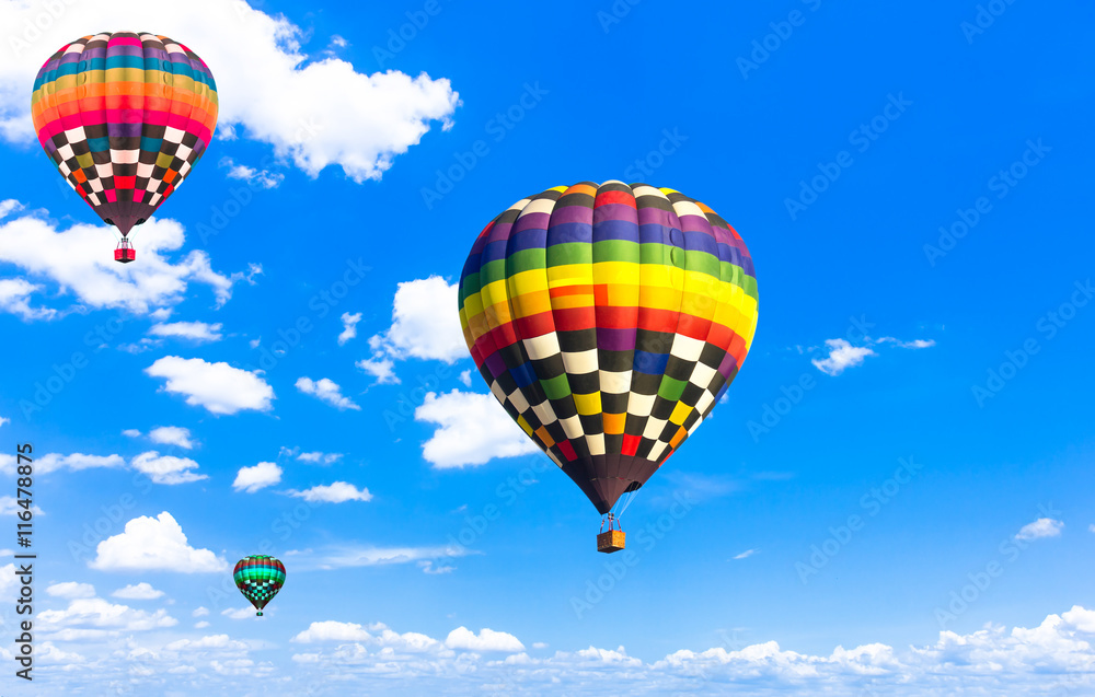 Fototapeta premium balloon Beautiful colorful hot air balloon flying in the vast sk