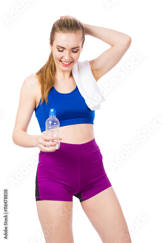 Young healthy fitness girl with bottle of water isolated on white background