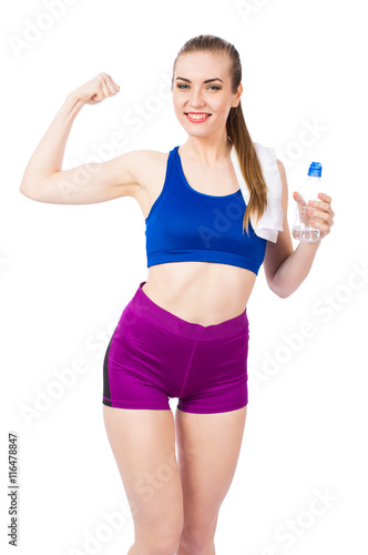 Young healthy fitness girl with bottle of water isolated on white background © redfox331