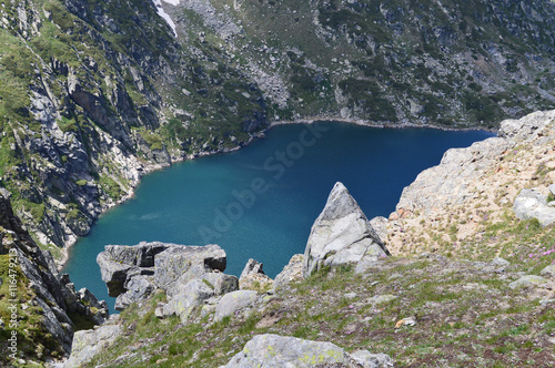 Fototapeta Naklejka Na Ścianę i Meble -  Karagyol – high-mountain dam lake situated at 2364 m altitude in Rila Mountain, Bulgaria. The lake is part of Kalin pumped-storage hydroelectric plant and Rila hydro-power cascade.