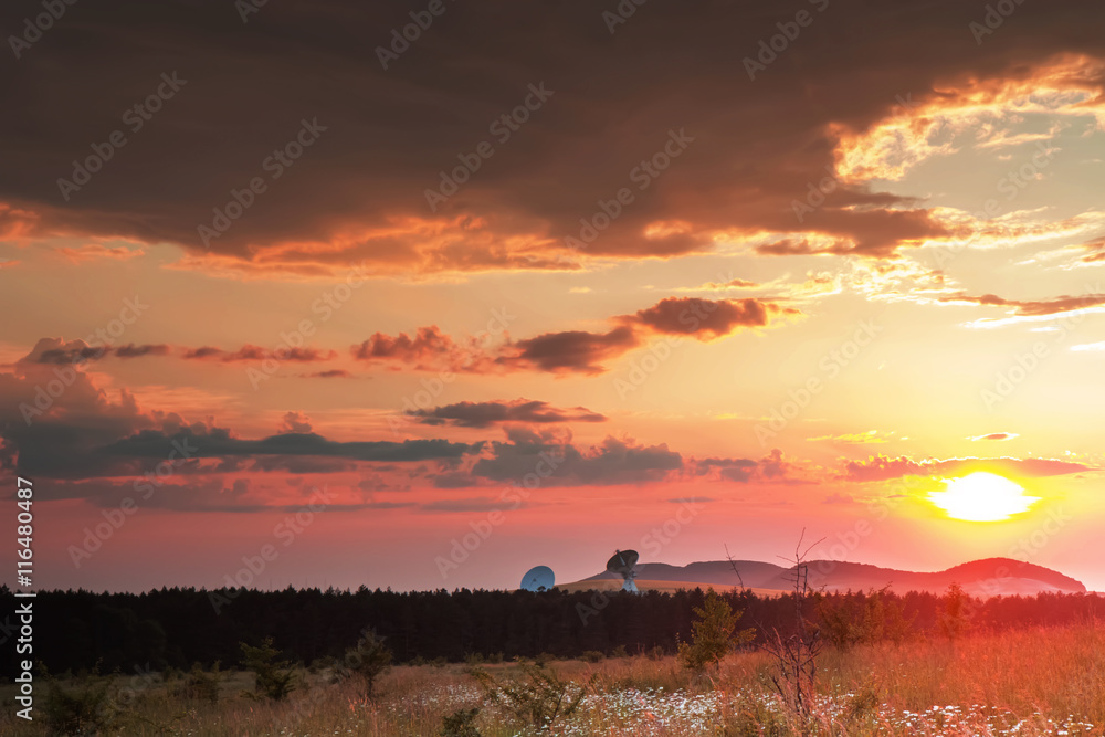 radio telescopes at sunset