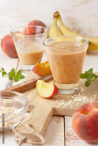 peach banana smoothie in a glass