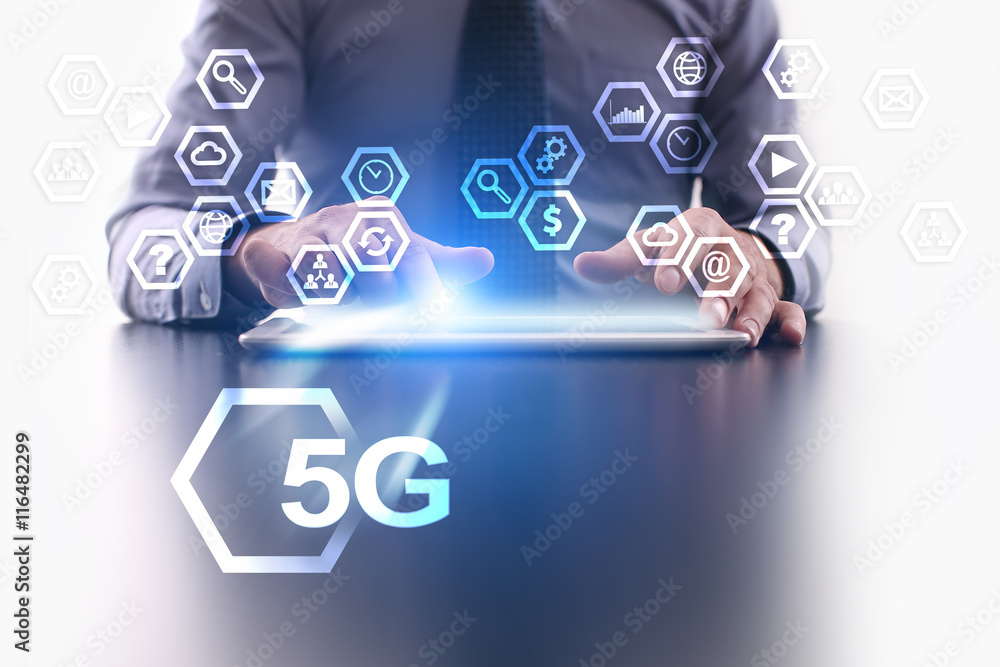 Businessman is using tablet pc and selecting 5G icon. Businessman is using tablet pc and selecting 5G icon.