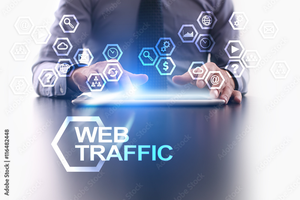 Businessman is using tablet pc and selecting Web traffic icon.