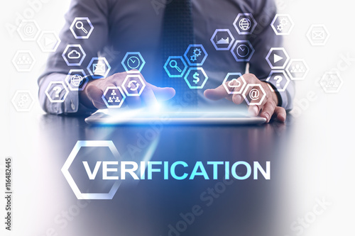 Businessman is using tablet pc and selecting Verification icon.
