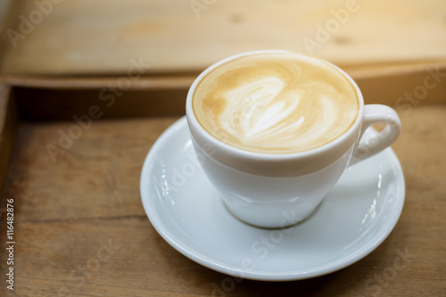 hot latte art on wood table background