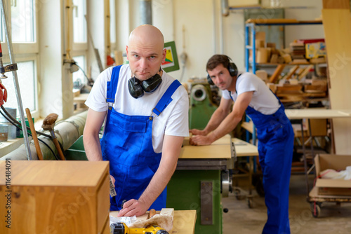 two worker in a carpenter's workshop © Firma V