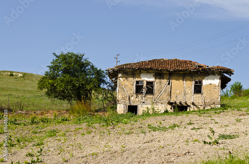 Old dilapidated house near the village Katselovo photo