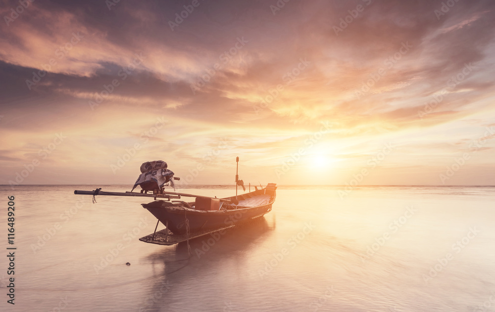 Traditional thai boats at the sea with beautiful sunset