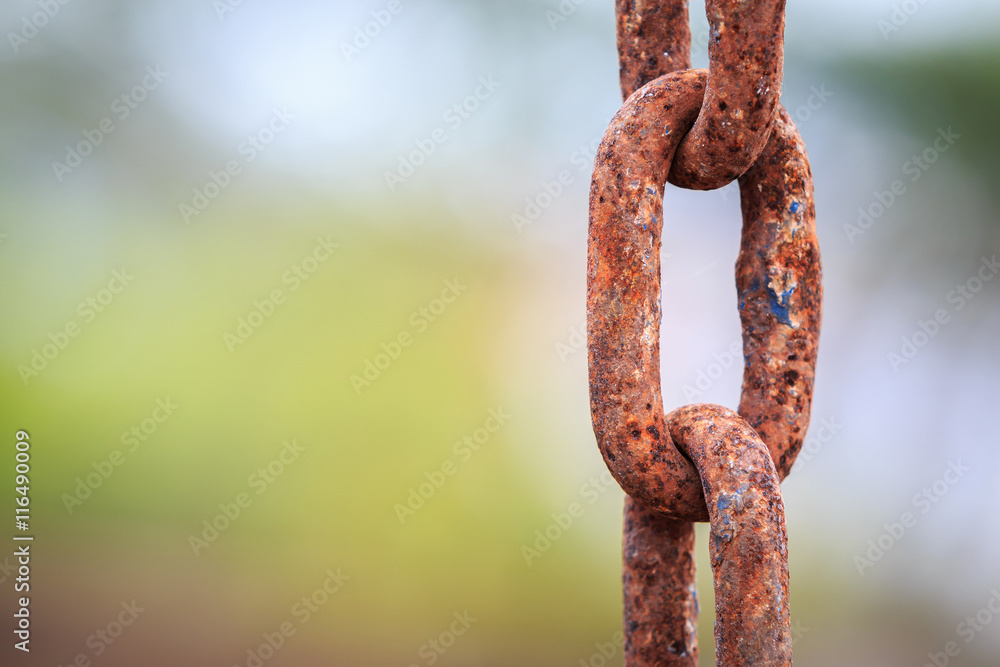 Old and rusty chain on blur background Old and rusty chain on blur background