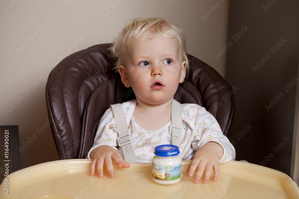 Two year baby boy sitting at the dinner table Two year baby boy sitting at the dinner table