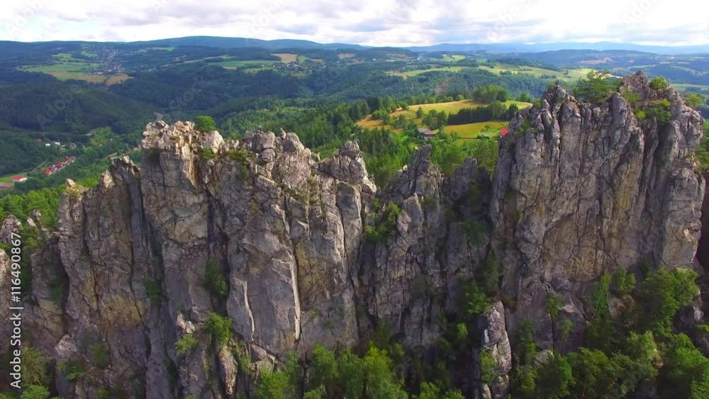Camera flight over mountain range. Video from drone. National park Cesky Raj near Prague in Czech Republic. Amazing places in Central Europe. Destination for hiking, mountaineering and climbing.