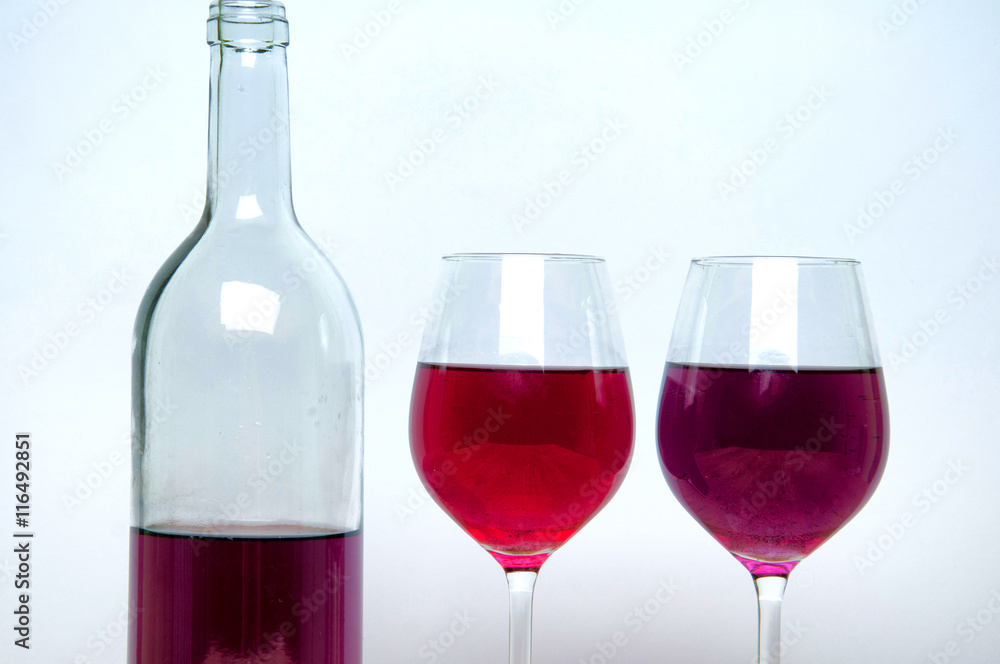 Wine glass and bottle on white Wine glass and bottle on white