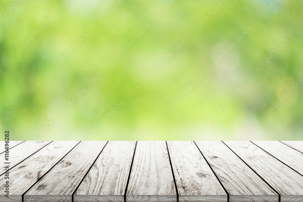 Empty wooden table with blurred city park on background Empty wooden table with blurred city park on background