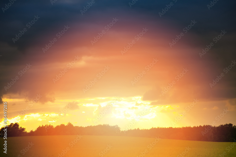 Dramatic sunset over fields