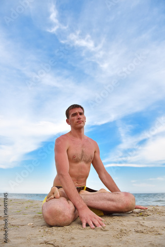 young man sitting in lotus position