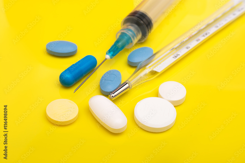 Pills isolated on a yellow background