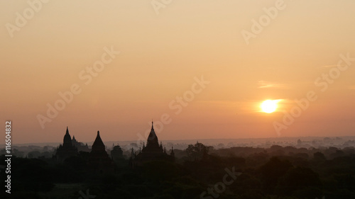 Balloons above the pagodas during sunrise